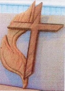 The cross and flame, the logo of The United Methodist Church, that Peter Etcheto carved for Rev. Sanford from wood salvaged from the balcony. Another one of Peter’s cross and flame carving from the same wood hangs in our sister church in Cochabama, Boliva.